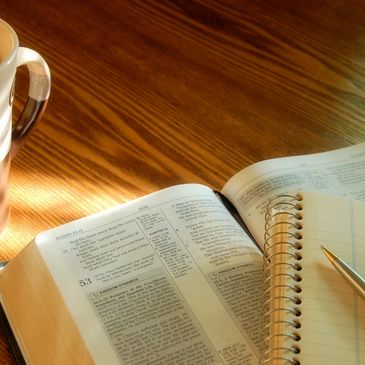 Open Bible on wooden table